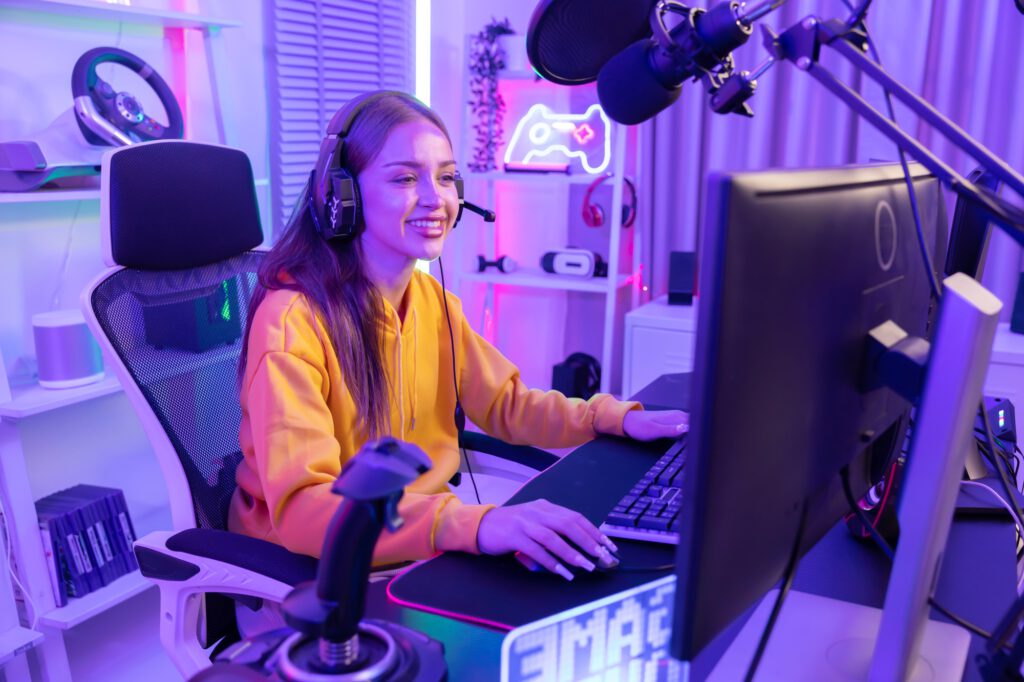 Caucasian Female Gamer Playing PC Game with Mouse and Keyboard in Neon Game Room
